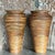 Elegant pair of vintage coastal pencil reed vases. Crafted with intricate reed detailing, these vases exude natural...
