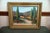 An original 1977 oil on canvas landscape signed Larson, depicting a sunlit Southwestern countryside with adobe-style...