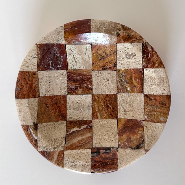 Carved beige and cocoa travertine trinket dish. The stone is cut into squares and placed in a checkerboard design. It has...