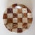 Carved beige and cocoa travertine trinket dish. The stone is cut into squares and placed in a checkerboard design. It has...