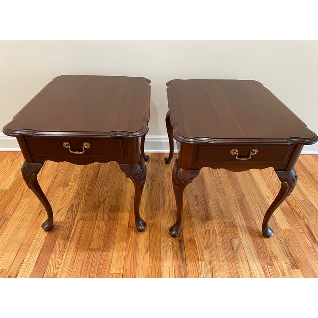 Pair of vintage Ethan Allen Georgian Court Queen Anne Style Side Tables in solid cherry. A beveled top with a single...