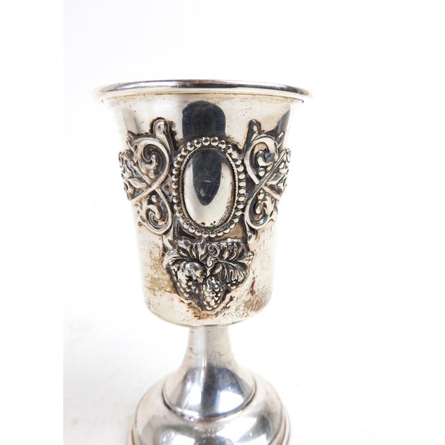 Vintage mid 20th century sterling silver kiddush cup with grape and vine motif. Marked sterling and made by Eastern...