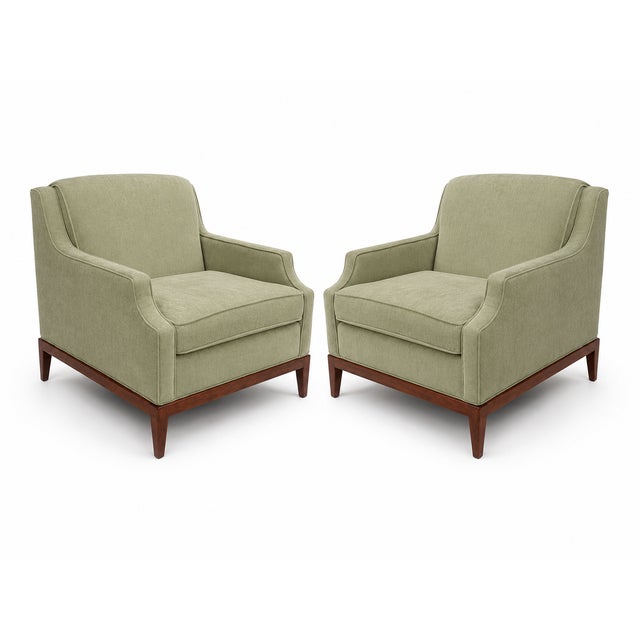 Mid century modern lounge chairs. Chairs have walnut bases, refinished. Fabric is light green chenille. The set was...