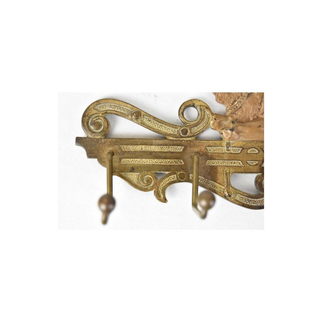 Cast iron polychrome Egyptian Revival rack was manufactured by the Judd Mfg. Co. It is marked no. 1598 on the back. It was...