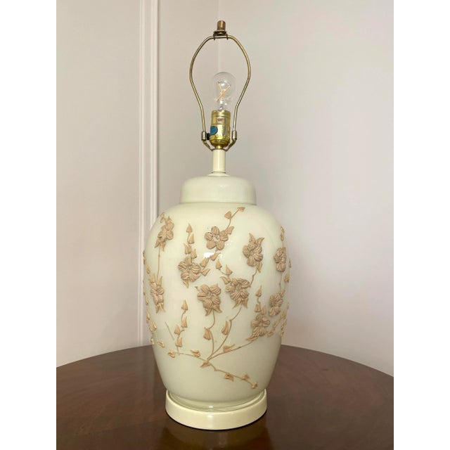 This a beautiful chinoiserie l ceramic/glass vintage antique white table lamp which also has an Asian botanical feel to...