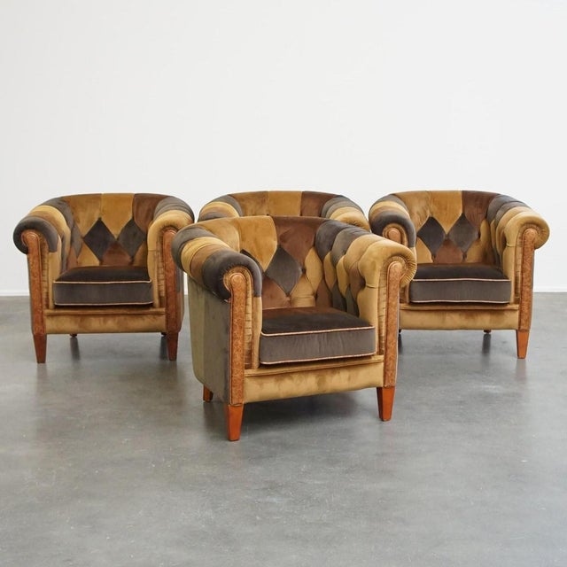 Offered is this unique set of 4 English style fabric patchwork chesterfield club chairs in good condition. This fantastic...