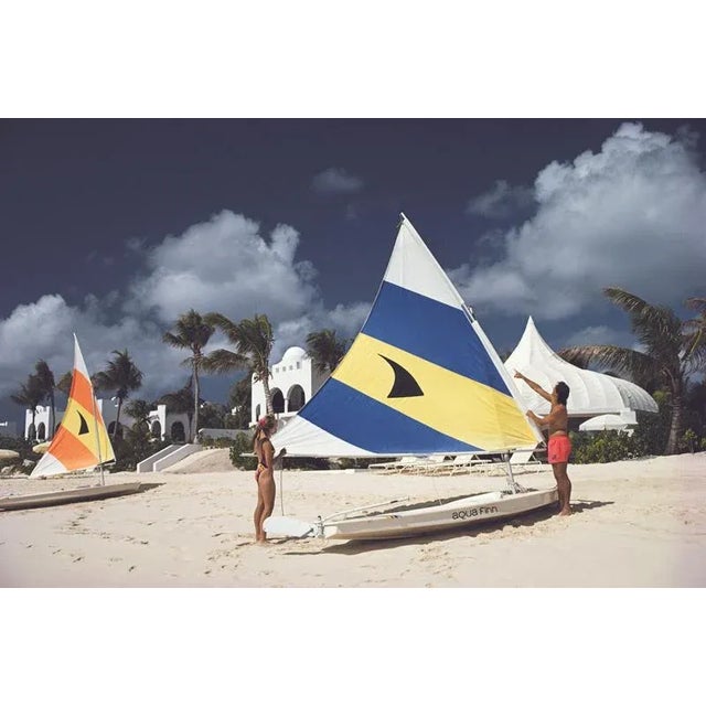 Sailing In Anguilla 1992 A couple adjusting the sail on their dinghy at a luxury resort on the island of Anguilla in the...