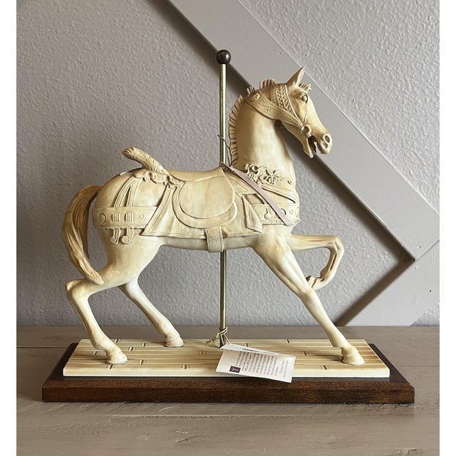 This is a beautiful limited edition scale-model replica of an antique wooden horse that is found on the carousel at the...
