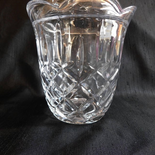 This is a cut crystal biscuit Barrel with a matching lid. I have not found any markings on it and do not know who made it....