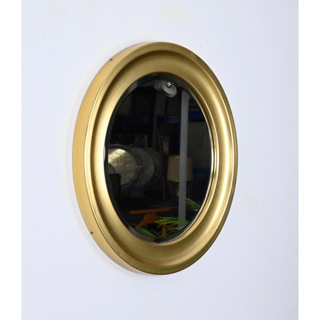 Magnificent modernist mirror designed by Sergio Mazza for Artemide in Italy during the 1960s. This rare version of the...