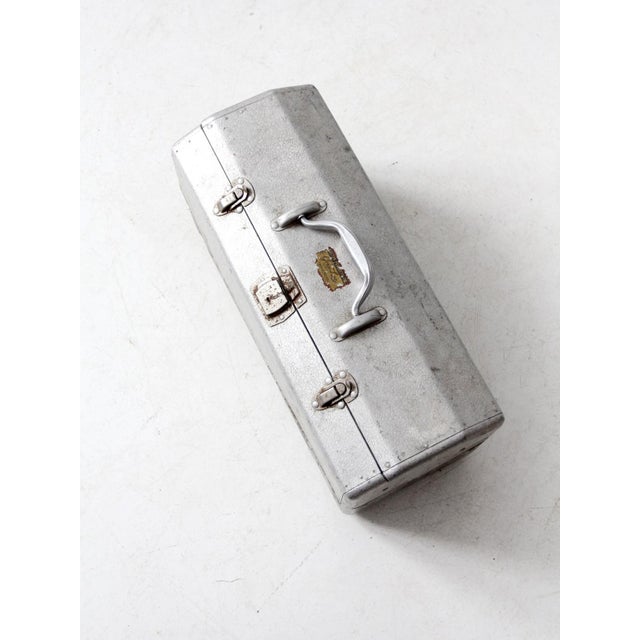 This is a Walton Products Inc. Grip-Loc tackle box. The aluminum mid century box is sturdy yet light weight. The interior...