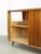 - Glossy finish - Golden ornaments (on glass and wood) - Used to store LP records and a record player (right side) as the...