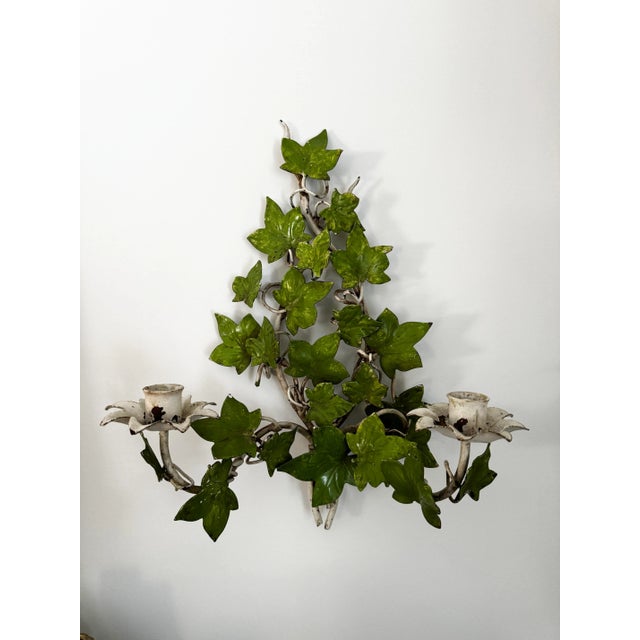 Pair of Vintage Italian Hollywood Regency Tole Painted Green Botanical Ivy Leaf Wall Candle Sconces, each having two arms.