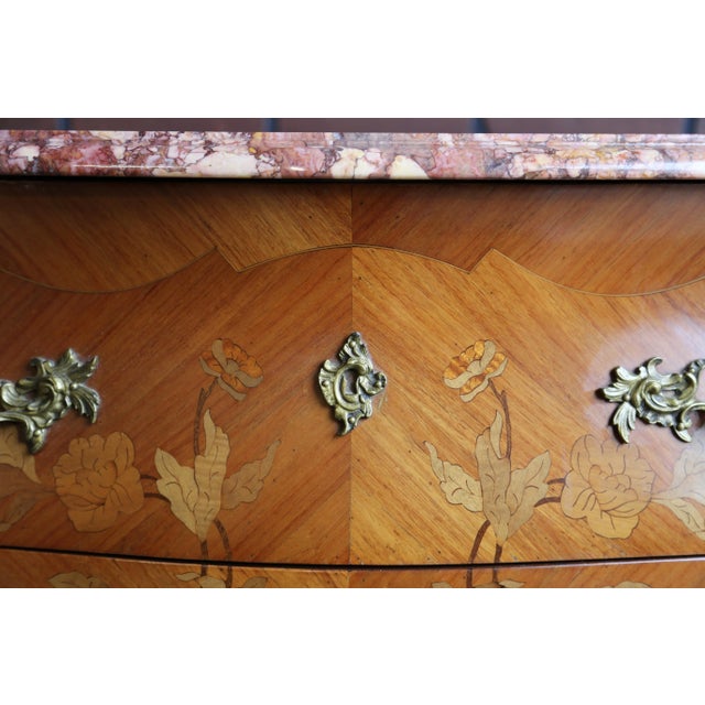 Antique French Louis XV marble top bombe chest imported from Europe. Incredible intricate patterned inlay veneer drawer...
