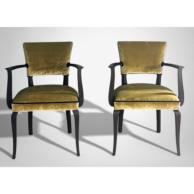 Elegant and refined pair of French “Bridge” chairs, crafted from solid wood with a black lacquered finish. The overall...