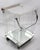Chic serving cart in Lucite with chrome handle, mirrored bottom shelf, and wood butcher block top. This service trolley is...