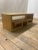 Kee Kee coffee table by Brueton. Custom shelved coffee table in light golden brown finish. Functional storage or display....
