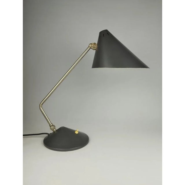 A factual, elegant desk lamp of the Hanoverian lamp factory Hala, around 1960. The large shade ensures optimal...