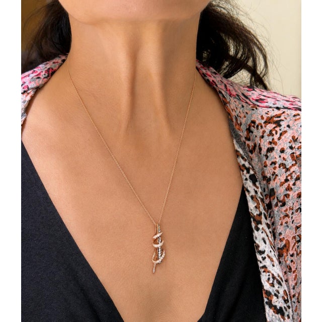 14k Levian rose gold pendant with approximately 1.00 carat of white and champagne round brilliant diamonds. 4.08 grams