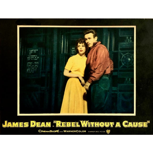 This piece is an original vintage theater lobby card from the 1955 release of the cinematic masterpiece “Rebel Without a...