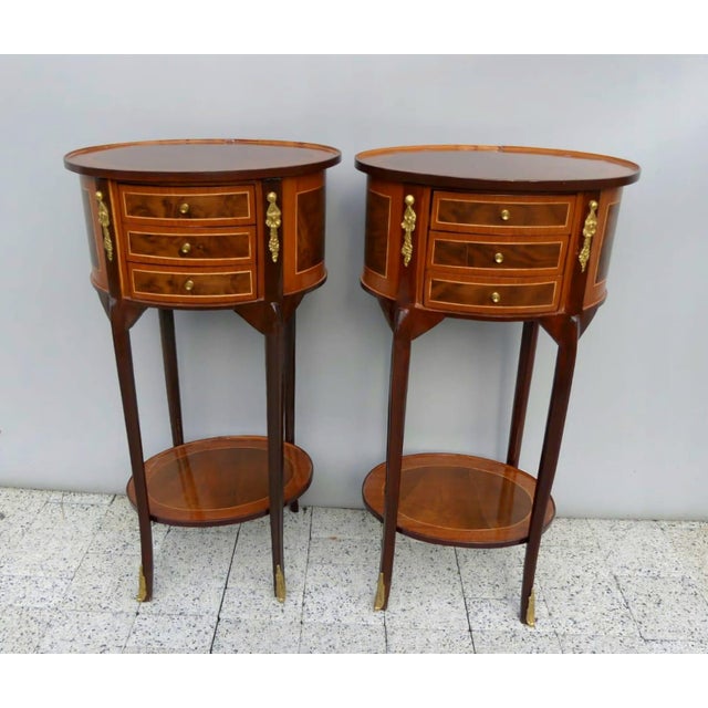 Add timeless French sophistication to your home with this elegant Louis XVI round side table, expertly handcrafted from...