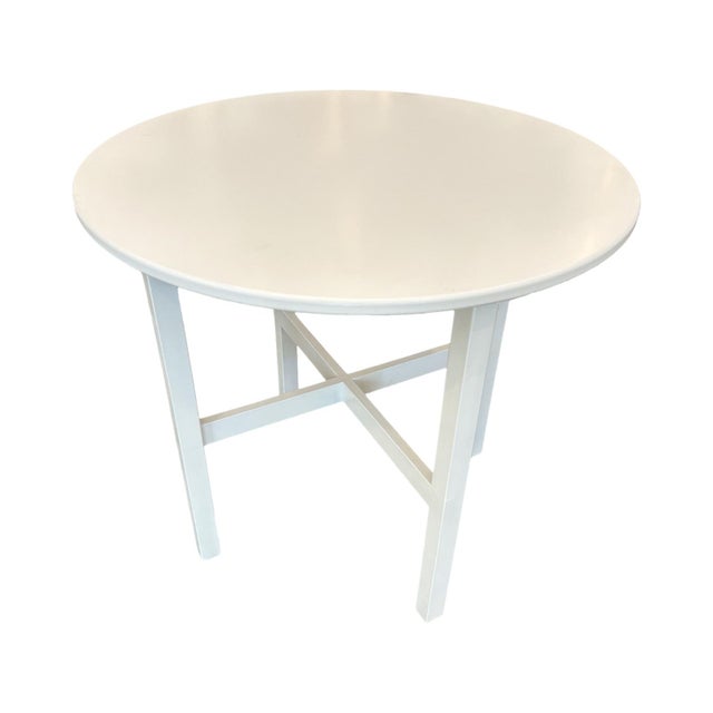 A simple white laminated wood table is transformed by this exquisite and high quality silk tablecloth; the fabric is an...