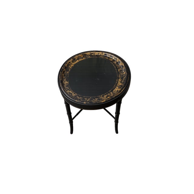 English papier-mâché tray table on a faux bamboo stand, showcasing a richly decorated, time-worn surface with gilt...