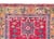 A striking early 20th century Persian Karaja rug with a tribal pattern containing three large central medallions heavily...