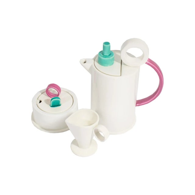 A Postmodern ceramic teapot with a matching sugar bowl and creamer designed by Italian architect and designer Marco Zanini...