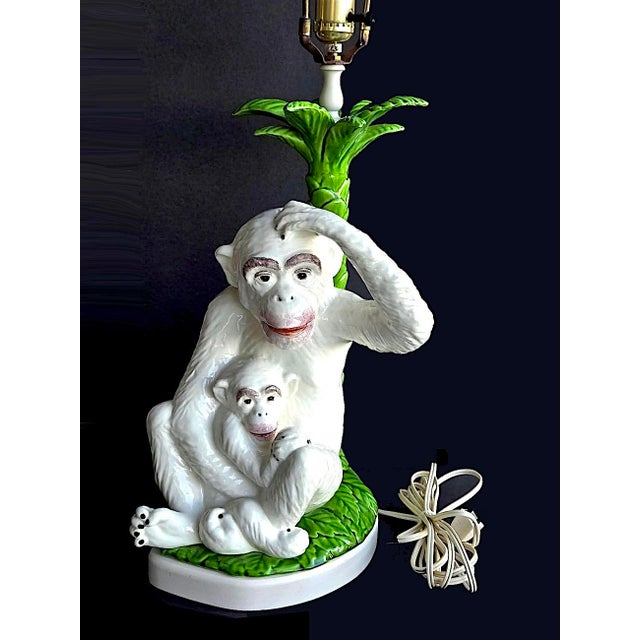 Offered is a large majolica ceramic monkey with baby and palm tree statue made in Italy in the 1960s. 15.25"H x 10"W x 9"D...