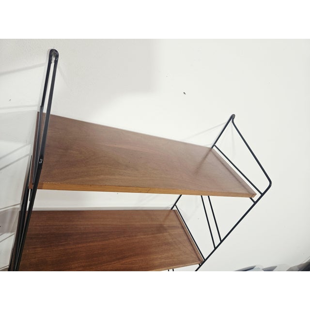 This unique, incredibly stylish wall shelf consists of three wooden shelves finished with a beautiful, warm natural veneer...