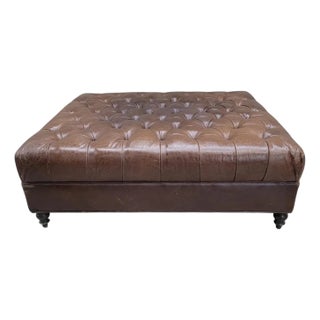 Vintage Oversized Tufted Distressed Leather Ottoman on Turned Legs For Sale