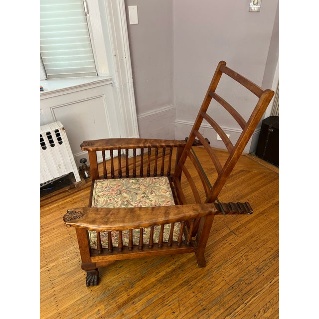 Vintage, likely 1930s, reclining arts-and-crafts, Morris style oak chair with floral upholstery.