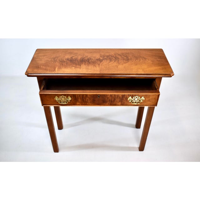 Vintage Chippendale style small scale book matched Mahogany console side table with a single raised beaded drawer....