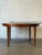 Dyrlund Lotus Round Teak Dining Table With Flip-Out Extension Leaves – Vintage Danish Mid-Century Modern For Sale - Image 11 of 12