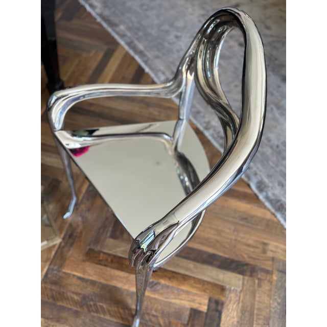 Design taken from the painting “Femme à tête de roses” (1935) by Salvador Dalí. Structure made of polished brass casting....