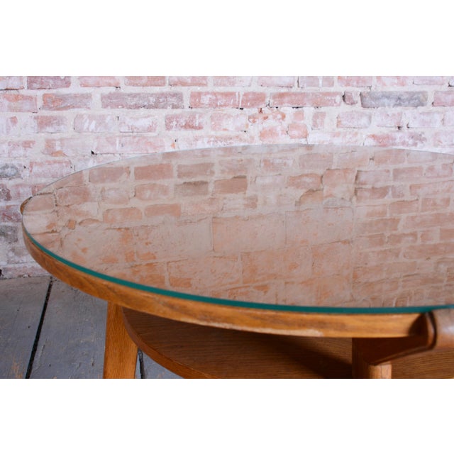 This round coffee table is an elegant representative of Czechoslovak Mid-Century design from the mid-20th century. This...