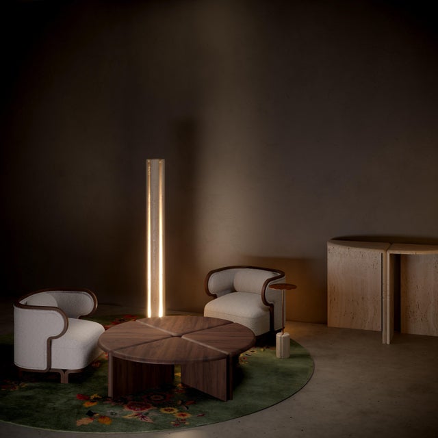 A floor light conceived as a sculpture and presenting as a totem. Handmade out of 4 pieces of honed unfilled Navona...