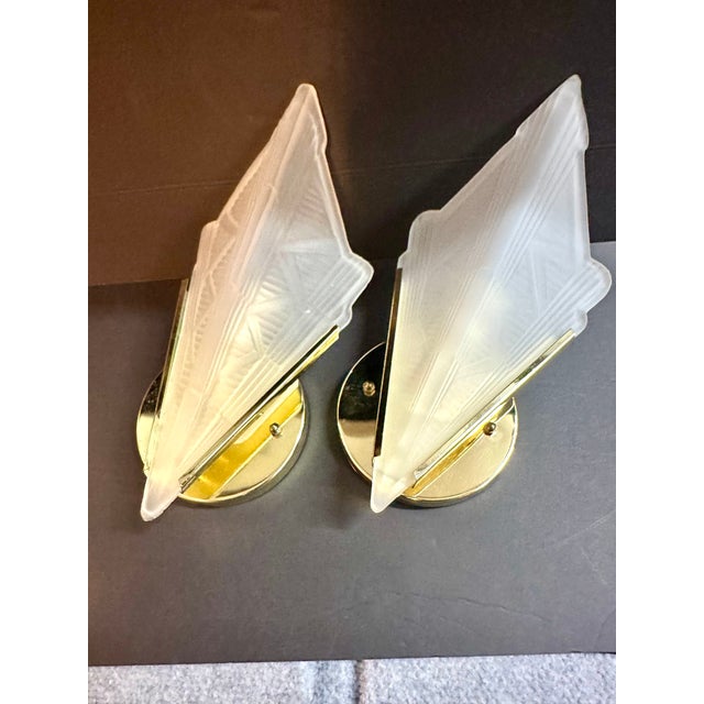 Pair (2) Art Deco style wall sconces each with a geometric triangle-shaped frosted, pressed glass shade. Unique geometric...