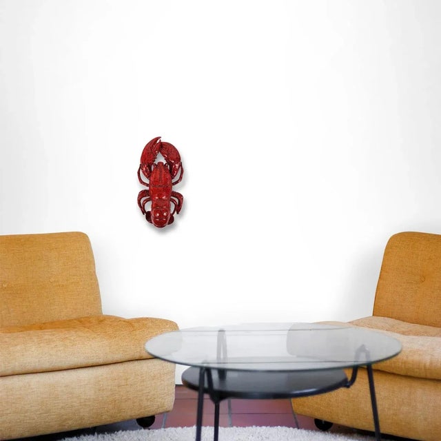 Wonderful lobster made of ceramic with gloss glaze. It is larger than life so it would make a perfect kitchen accessory....