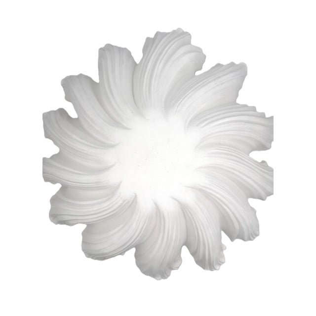 Inspired by the graceful movement of flower petals, this distinctive fixture features a dramatic layered floral silhouette...