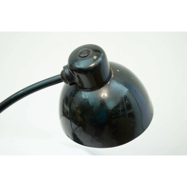 This Bauhaus desk lamp was designed by Marianne Brandt for Kandem Leuchtenbau Leipzig. It features a glass base and is...