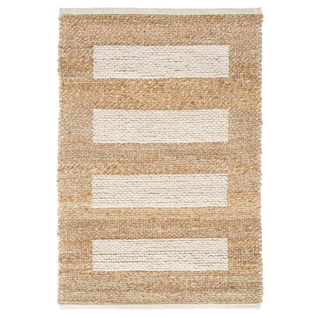 Sand bars of natural jute appear to float on a marled slubby cotton ground. Cool and crisp underfoot, jute and chenille...