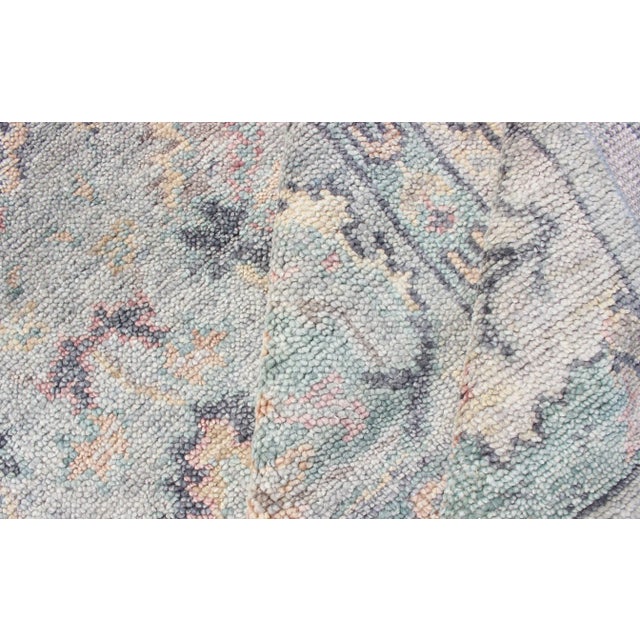 Hand Knotted Wool Oushak Rug Featuring Floral Designs in Muted Colors For Sale - Image 10 of 12