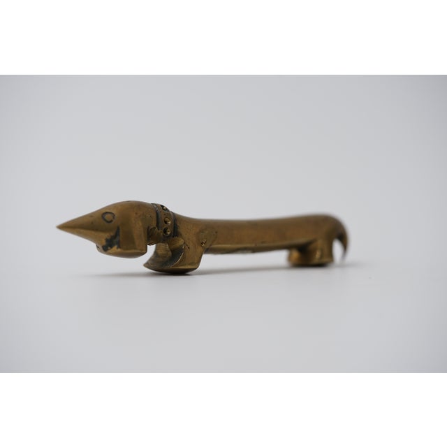 Object: Bottle opener in the shape of a dachshund Designer: Walter Bosse (1904–1979) Age: 1950s/1960s Material: Brass...