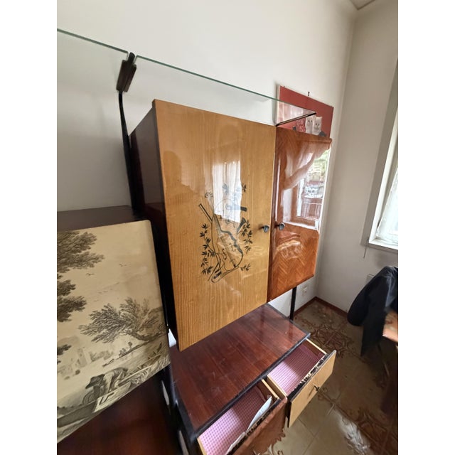 Italian modular cabinet in the style of Silvio Cavatorta, 1950s. Enamelled aluminum and brass handles, metal frame, glass...