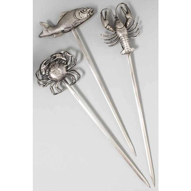 Three characteristic decorative skewers seafood with fish, lobster and crab at the top. The figures are two-piece, hollow...