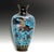 A finely decorated Japanese cloisonné vase dating to the 19th-century Meiji period. The vase features a mythical Ho-Ho...