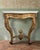 Discover the allure of this highly decorative shabby chic Louis XV style gilt wood console table or hall table, crowned...