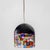 “Tinta” pendant lamp with a black, bell-shaped glass shade, the lower edge of which is worked in a colorful murrine...